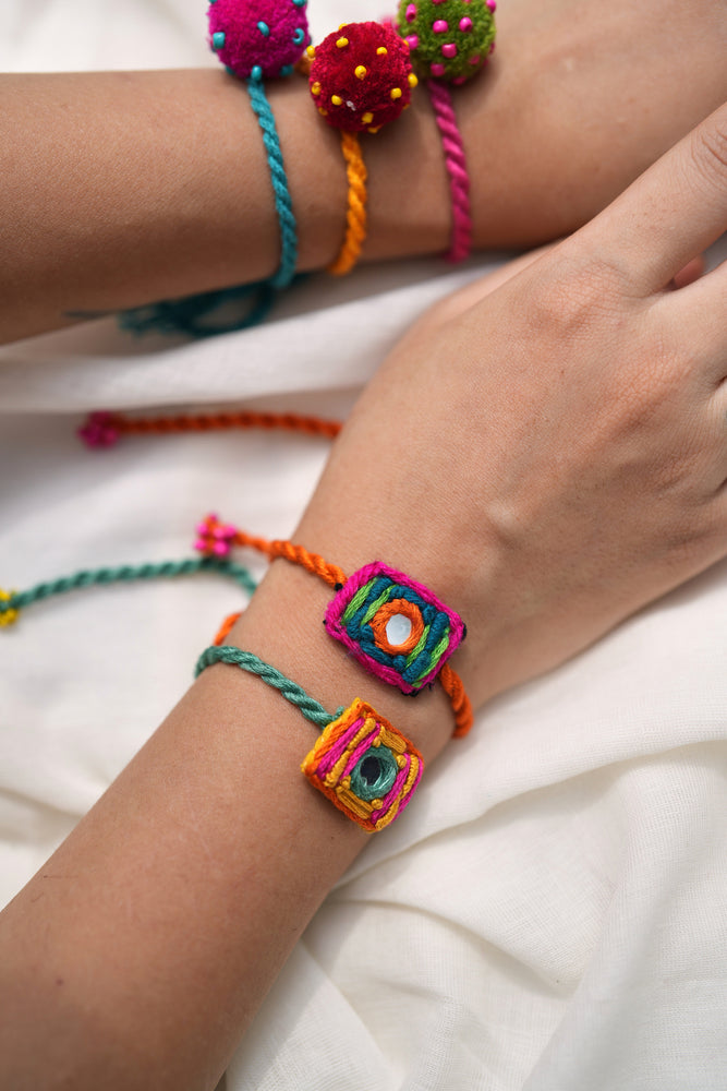 
                  
                    Mini laddoo & aaina rakhi - set of five
                  
                