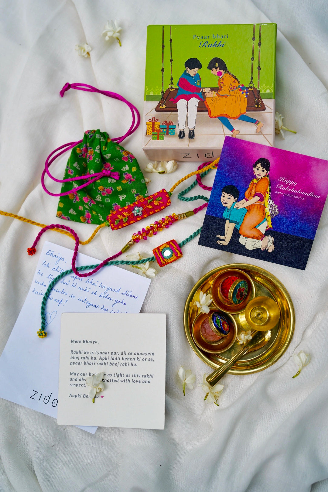 
                  
                    Aaina Lumba Rakhi - Set of two
                  
                